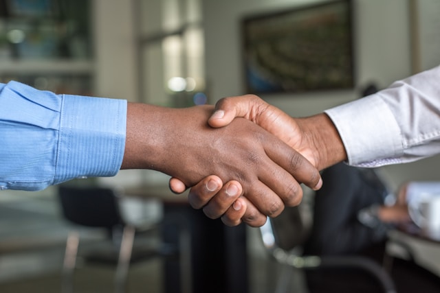 Partnership handshake representing our strategic collaborations
